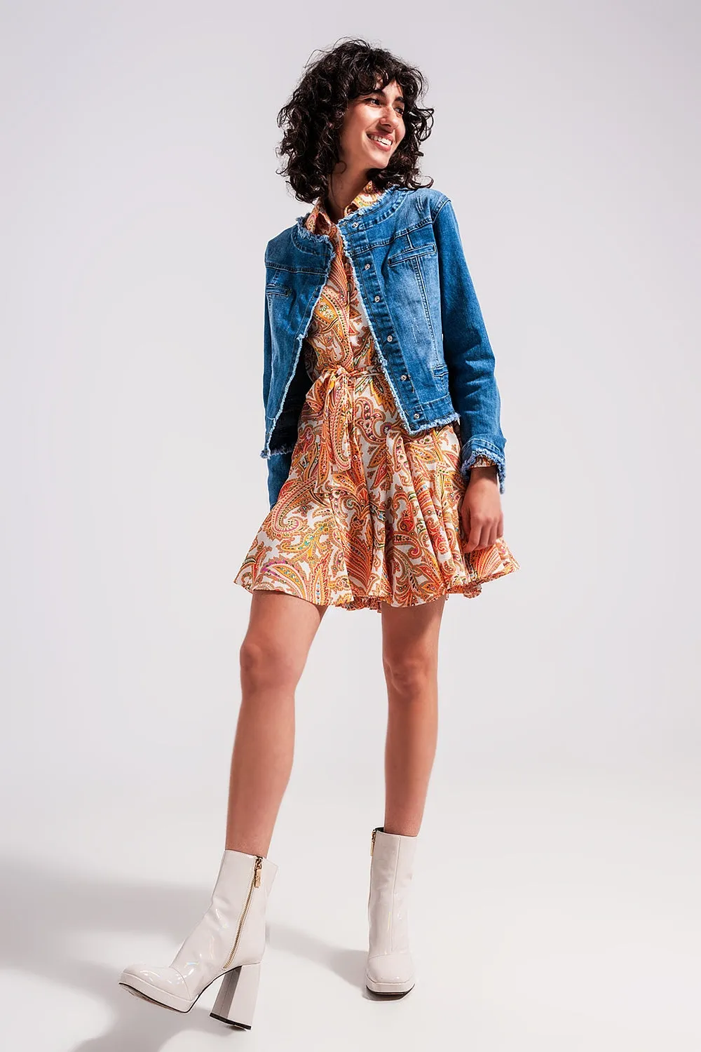 Light wash denim jacket with raw hem edge
